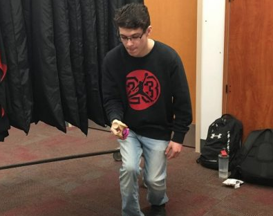 Senior Jeffrey Robinson prepares to execute a trick. Kendamas are making a comeback after disappearing for 6 years. Sweets Kendamas is a local Minnesota company that is a favorite of students.