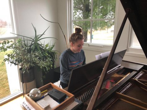 Sophomore Hannah Dettmann practices her musical selection she has prepared for coffee house. "I love performing because it gives me such a rush, it's a great feeling," Dettmann said.