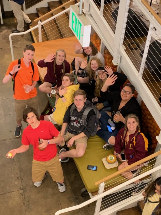 Pony Express students sit together to enjoy live music and food from the Packing House District.