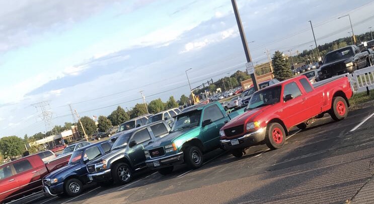 This photo was taken in the morning right before school showing the row in the back of the Black lot referred to as "Truck Row." The Truck Row for this year consists of many different types of trucks and people. 