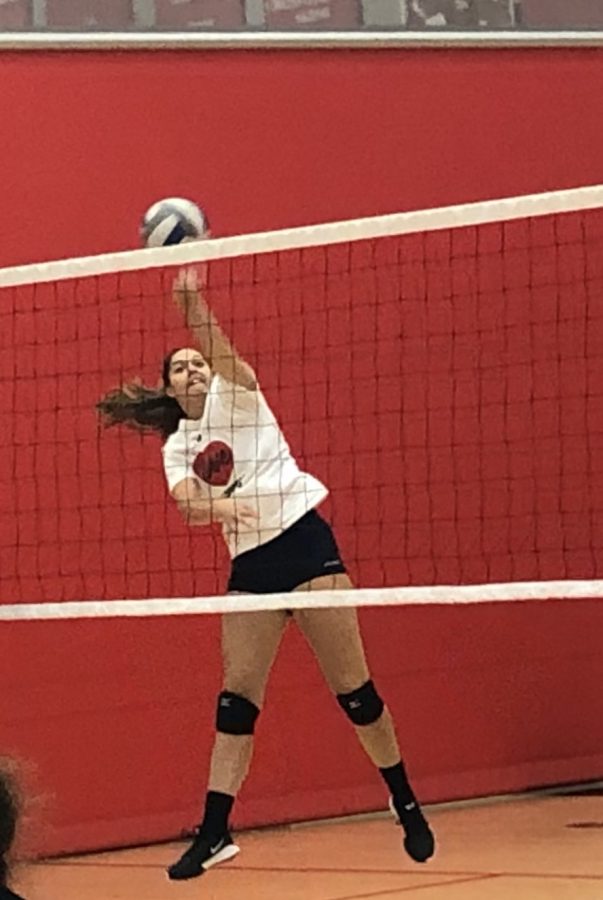 Junior Sydney Dejarnett goes for a kill during practice last Tuesday, Sept. 12. The team looks to improve their number of wins against Forest Lake on Tuesday.