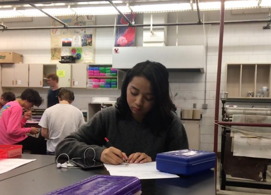 Senior foreign exchange student Yunita Erniajan works in her first hour metals and jewelry class. She prepares the design for a ring.