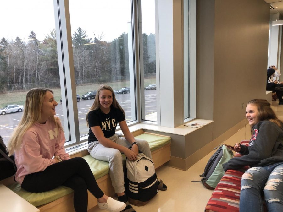 Freshmen Kendall Bajda, Eva Stafne, and Amelia Venzke hang out before the bell on a Friday morning. Rather than utilizing the Friday as a help day, they are waiting for the first bell to start their  seven hour school day.