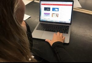 Senior Alli Hafner uses schoology to get classwork done. This is the main resource used in the newly implemented E-learning days.