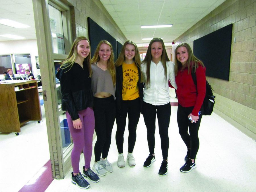 Freshmen Maya Hanlon, Kylie Ligday, Tori Lilijgren and sophomores Brynn Savelkoul and Kendall Rogers show off their Lululemon leggings. All of their outfits resemble each others.