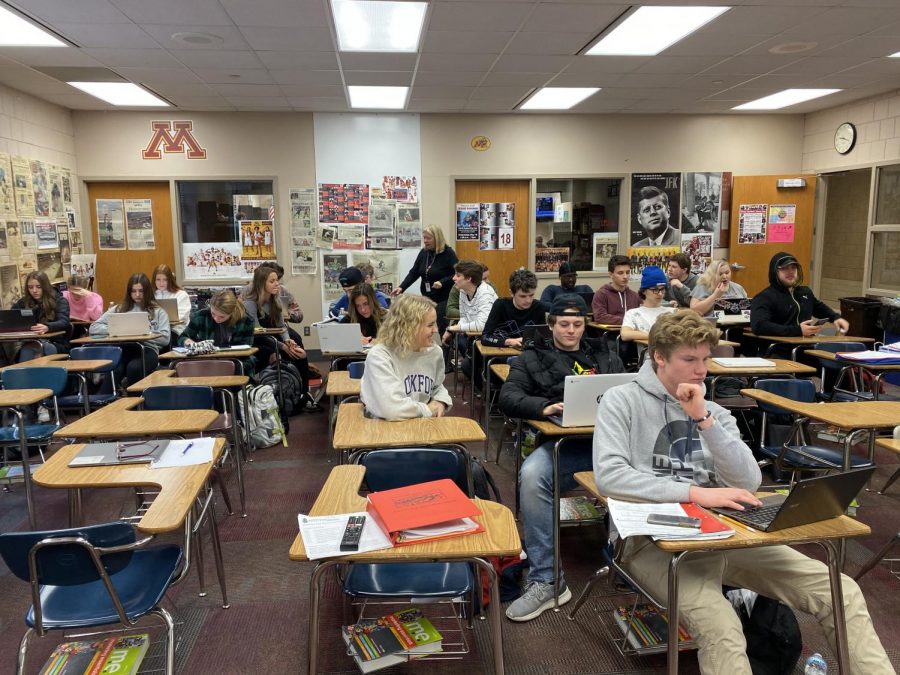 Debbie Drommerhausen has taught 46 years. Drommerhausen is teaches her second  hour class. She helps her students with a marketing and stats project.