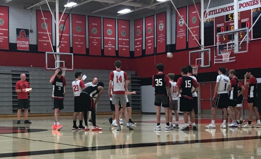 Boys basketball practices their free throws in the gym with varsity coach Brady Hannigan. The boys practice six days a week for around two and a half hours.