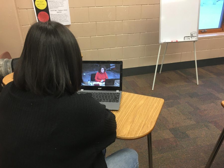 Junior Olivia Hovland watches the board meeting that happened on Jan 15. The board spoke about the different considerations that would affect the community.