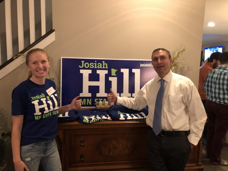 Senior Megan Puhrmann smiles with District 39 senator candidate Josiah Hill during a campaign gathering. Puhrmann began volunteering on the campaign in the fall, and she really enjoys it.
