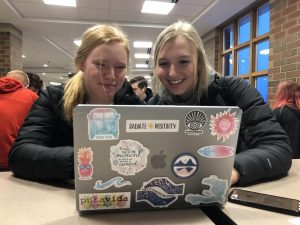 Juniors Elliana Linn and Trisha Jacobson collaborate on an online assignment. With the growth of technology, this type of assignment is becoming more popular.