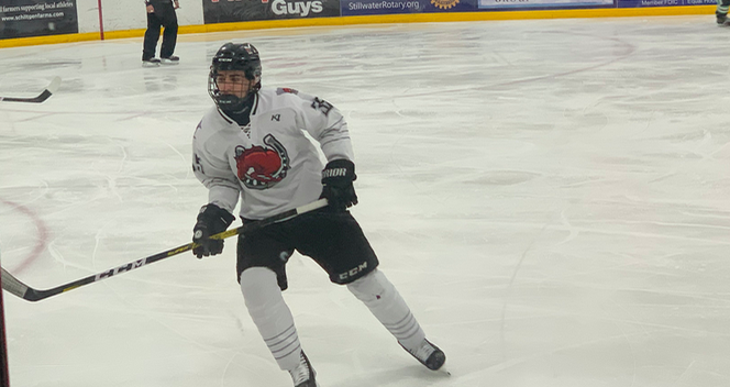 Freshman Ty Tuccitto plays his team’s rival, Hill Murray at his home ice on Jan. 21. Tuccitto plays forward. He plays a big role in scoring goals. 

