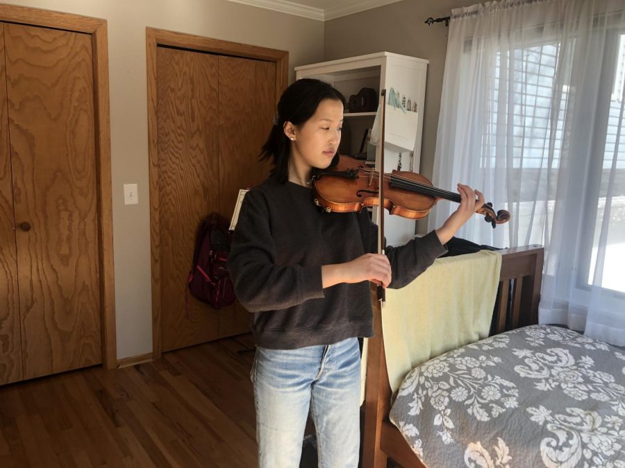Sophomore Katie Liss practices Max Bruch’s “Violin Concerto no. 1.” Concert Orchestra director, Zach Sawyer, due to distance learning constraints, will now have students input their goals for daily practice routine in a virtual practice journal.