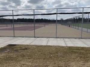 Tennis courts, which are usually filled with flying balls around the court, has no movement to be seen after school was cancelled.