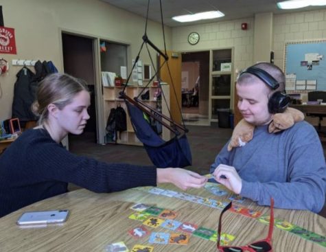 Senior Rachel Folden spends time with a fellow TRUST buddy. Building trust and friendships during meetings every  Wednesday strengthens the heart and mind to include anyone and everyone.