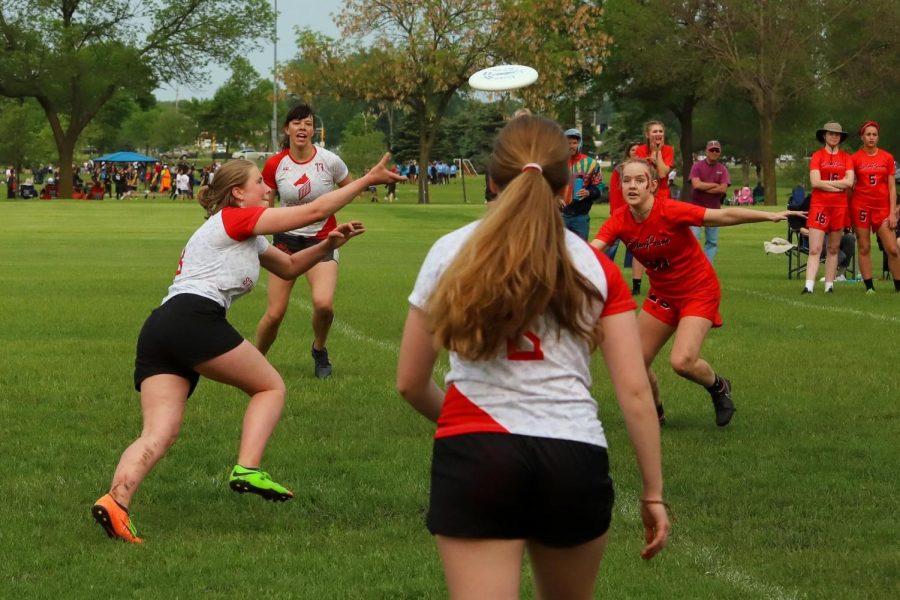 Junior Bijou Acers goes in for the catch in last years Girls Ultimate Frisbee team game against Eden Praire. Because the season has not yet started the photo is from last year.