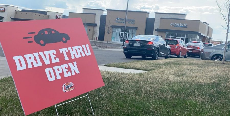 Cars+line+up+down+the+street+for+Raising+Canes+despite+being+encouraged+to+stay+home.+The+restaurant+has+experienced+a+shortage+of+employees+due+to+exposure+to+COVID-19.