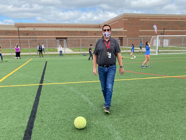 Special Education teacher Jon McAllister getting ready to participate in a game of soccer with some of his students wearing masks and staying socially distanced. Jon McAllister is finding new ways to keep his students active and entertained while being safe. 