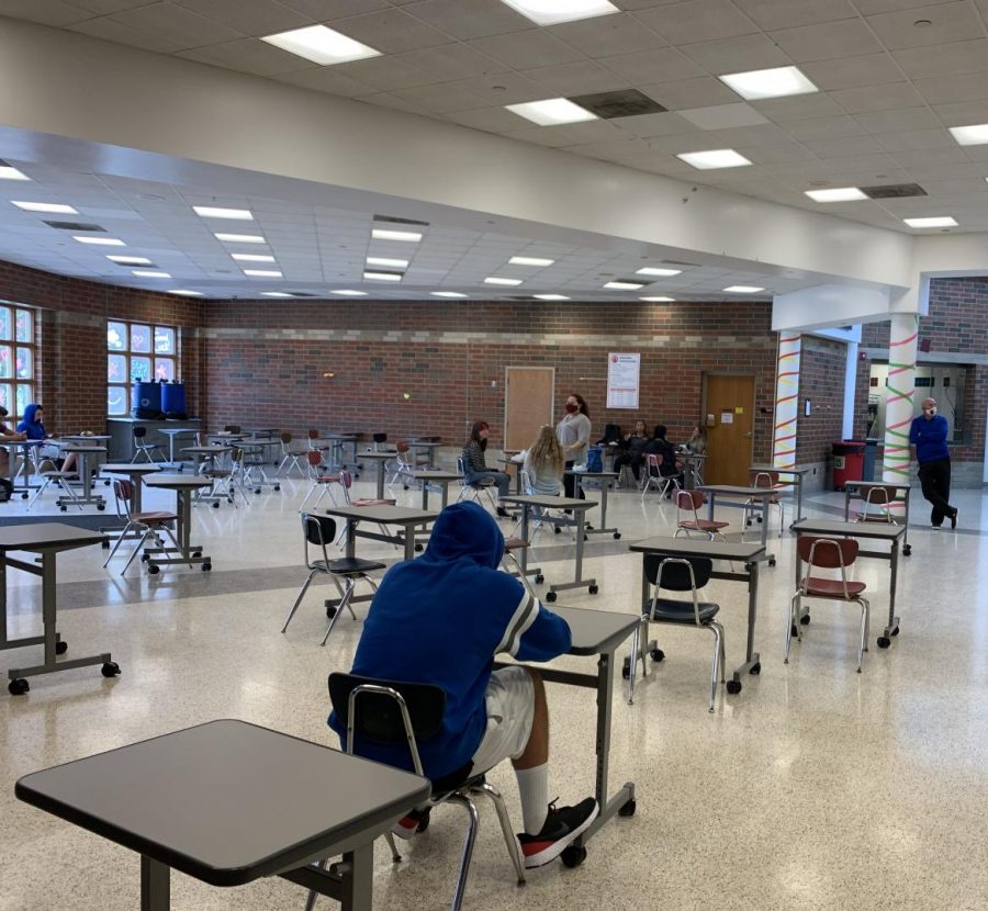 This is the new seating arrangement in the cafeteria for the 2020 school year. The cafeteria looks very quiet and empty due to the individual desks and the reduced number of students attending to lunch. 