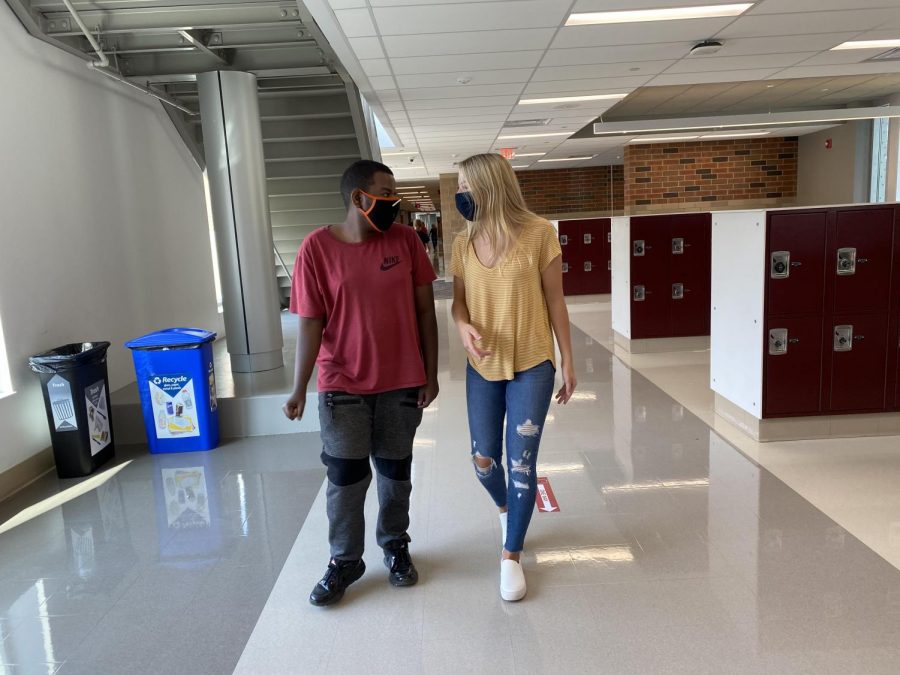 This is Audrey Colman and Zakaria Abdillahi on Wednesday after school walking to a teachers room. They are still following the one way hallways while still trying to figure them out. 