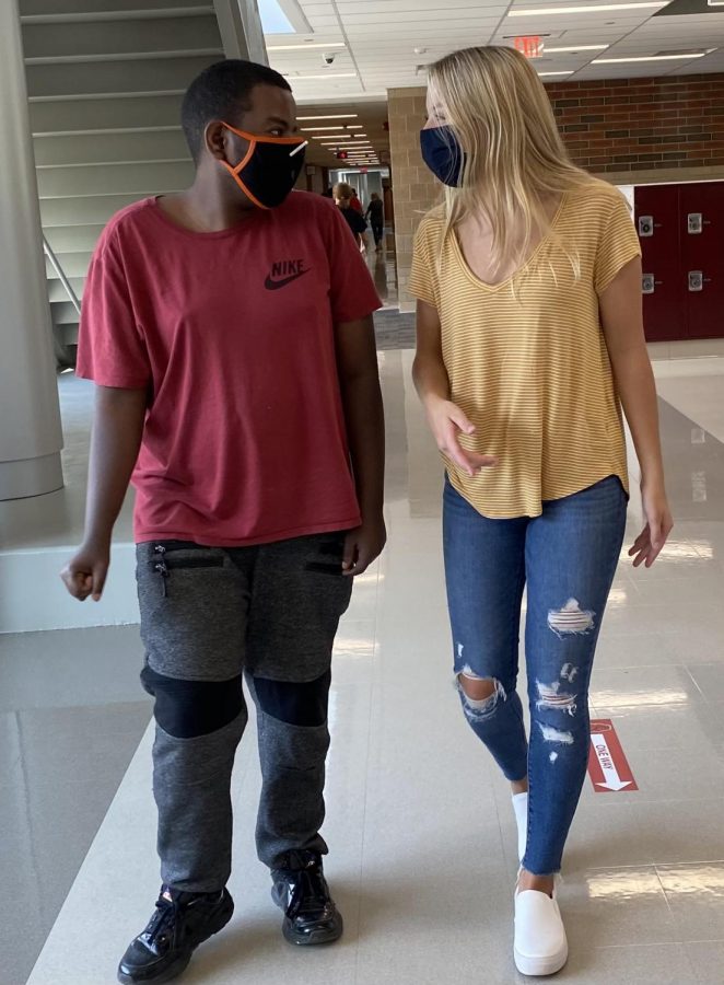 This is Audrey Colman and Zakaria Abdillahi on Wednesday after school walking to a teachers room. They are still following the one way hallways while still trying to figure them out. 