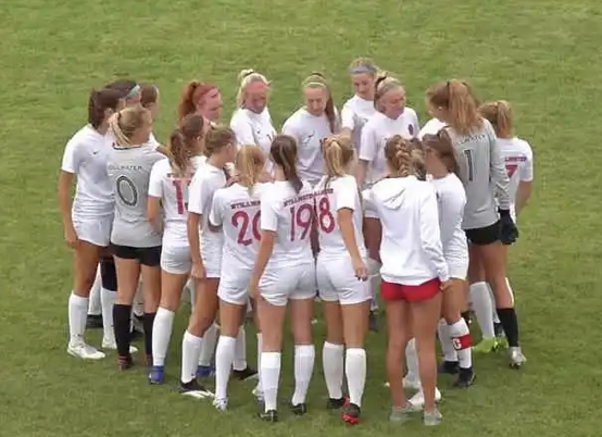 Stillwater girls varsity Soccer team huddles together for their game against Forest Lake. Photo by KSTP Sports