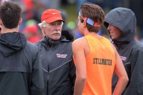 Coach Scott Christensen and runner Ethan Vargas have a conversation at a meet. The relationship between a coach and runner is very important.