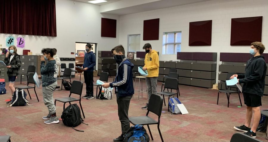 Students of the Freshmen Mens Choir join together to rehearse their music. Although they are wearing masks and six feet apart, they still can be together and create music through this pandemic. 
