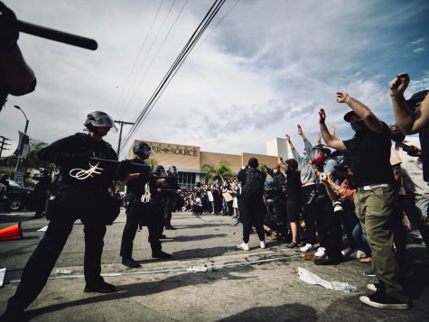 Peaceful Black Lives Matter protesters in Los Angeles stand together in the faces of law enforcement. A number of protests have emerged in prominent cities in response to the killing of George Floyd in the summer of 2020.