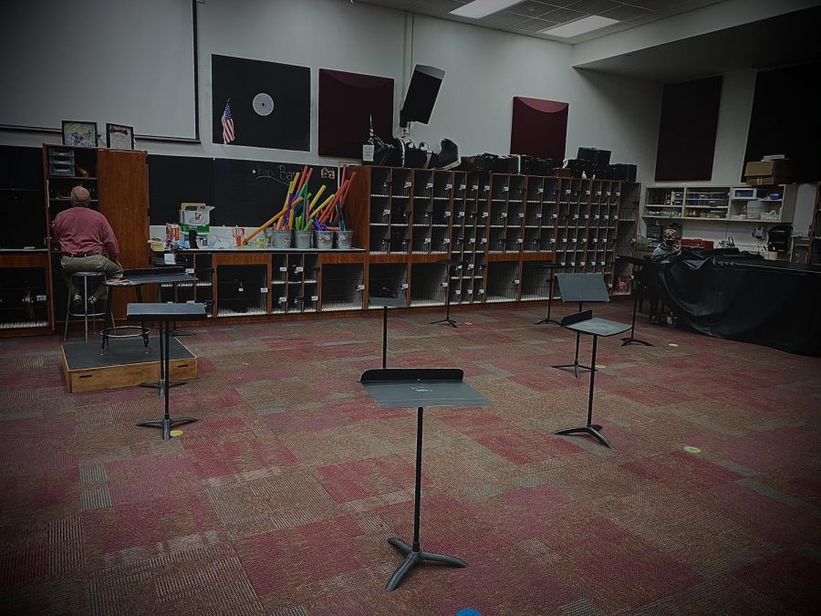 This+photo+shows+band+teacher+Dennis+Lindsay+along+with+his+one+in-person+student+for+Percussion+Ensemble+on+the+b+day.+A+room+that+would+usually+be+filled+with+around+30+students+playing+a+variety+of+instruments%2C+from+Marimbas+to+Tom+Toms%2C+instead+only+shows+one+student+and+Lindsay+doing+their+%E2%80%9Cindependent+studies%E2%80%9D+while+the+stands+and+chairs+%28not+pictured%29+sit+with+no+one+using+them+during+this+period.+Many+of+the+students+in+Percussion+Ensemble+are+doing+full+on+distance+learning%2C+and+in+early+November+with+the+start+of+quarter+two%2C+this+room+will+be+left+fully+empty.%0A