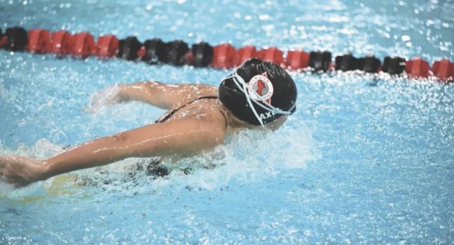 A swimmer does the breaststroke during the Oct. 13 meet against East Ridge.