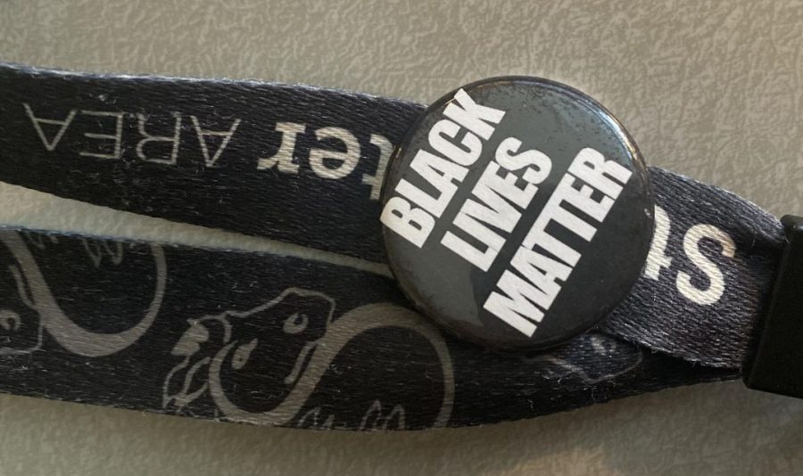 Social studies teacher Jason Caballero wears a Black Lives Matter pin on his lanyard. It is a subtle way of showing that he and his classroom are welcome to everyone. A pin is one of many forms of teachers showing their support for Black Lives Matter. 