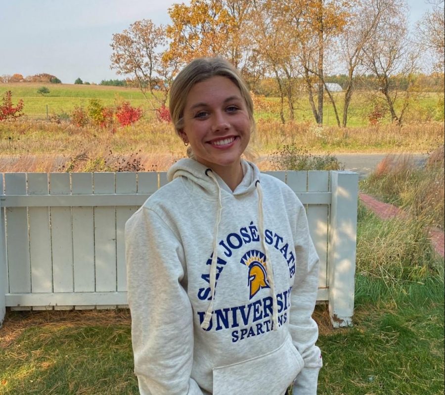Senior Hannah Dettmann posing, with a huge smile, with her San Jose State sweatshirt after announcing on social media that she was committed. This had been Dettmann’s goal since she was 15 and to finally achieve it was very overwhelming.
