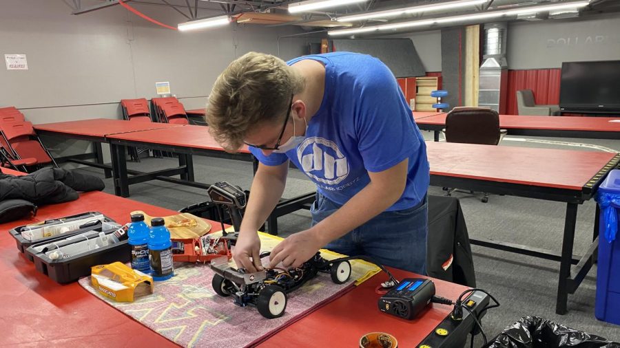 Senior Isaac Bursch changes a gear in his RC car. He spent nearly five hours practicing, and modifying for his Jan. 15 race.