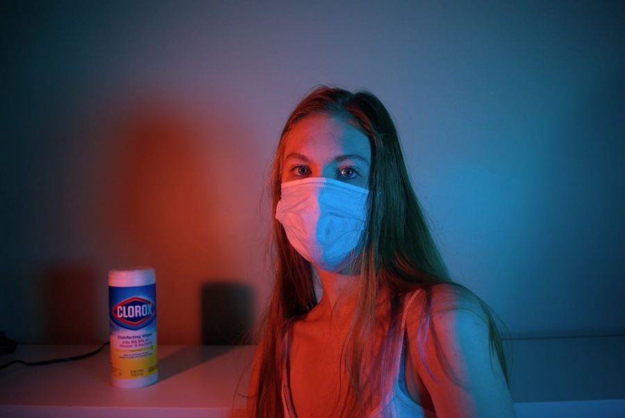 Ivy Lariviere poses for a self portrait on June 29, portraying the feel and reality of 2020 and now 2021 by including a face mask and Clorox in the background.