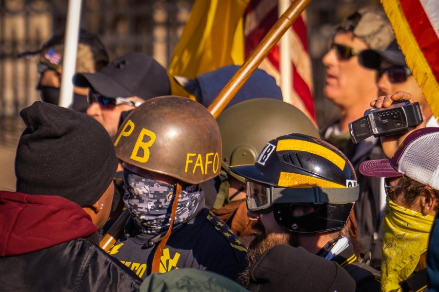 A clash between Proud boys, who are dressed in their groups signature black and yellow, and counter protesters outside the Minnesota Governor’s Mansion on Nov. 28, 2020 in a “Stop the Steal” protest. The white nationalist group is protesting over false allegations of voter fraud in the 2020 Presidential election.
