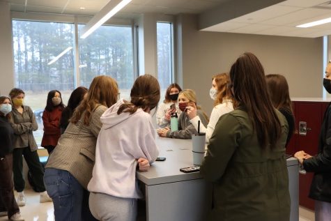 Members of the prom committee meet on March 10. Because of the pandemic, planning has become more difficult than in years past, but those involved have remained determined to give students a memorable prom. 