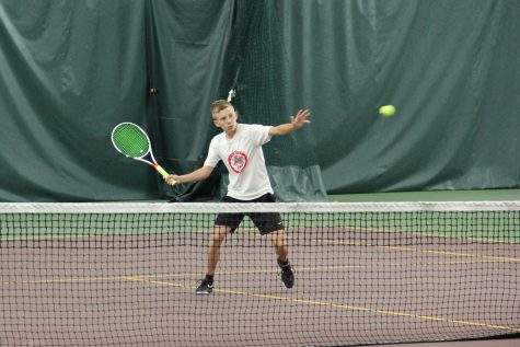 Junior Dylan Magistad playing tennis his freshman year, the last real season the boys were able to have due to COVID-19.