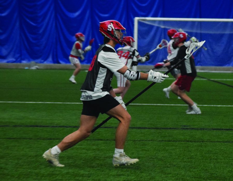 The boys lacrosse team practices at the Stillwater Rec. Center on Mar. 17. The captains for the 2021 season are seniors Isaac Albers, Gunner Arens and Alex Corbett.