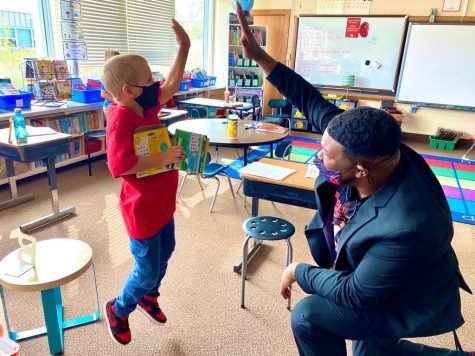Dr. Christopher Rogers, who will be Brookview Elementary School’s new principal in the 2021-2022 school year, visits classrooms and exchanges air high fives during his first day as interim principal at Afton-Lakeland Elementary in the 2020-2021 school year.