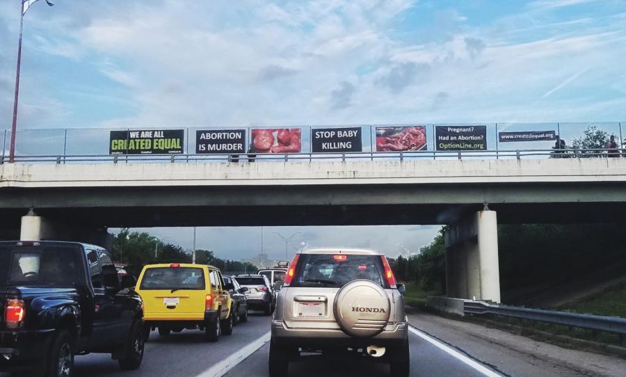 Political+signage+line+an+overhead+bridge+in+Columbus%2C+Ohio.+Many+other+bridges+like+this+one+on+I-70+hold+the+same+view+of+political+signs+on+abortion.+
