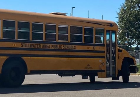 A district school bus picks up high school students to bring them home. The bus routes with drivers are making sure that students are transported to and from school safely.