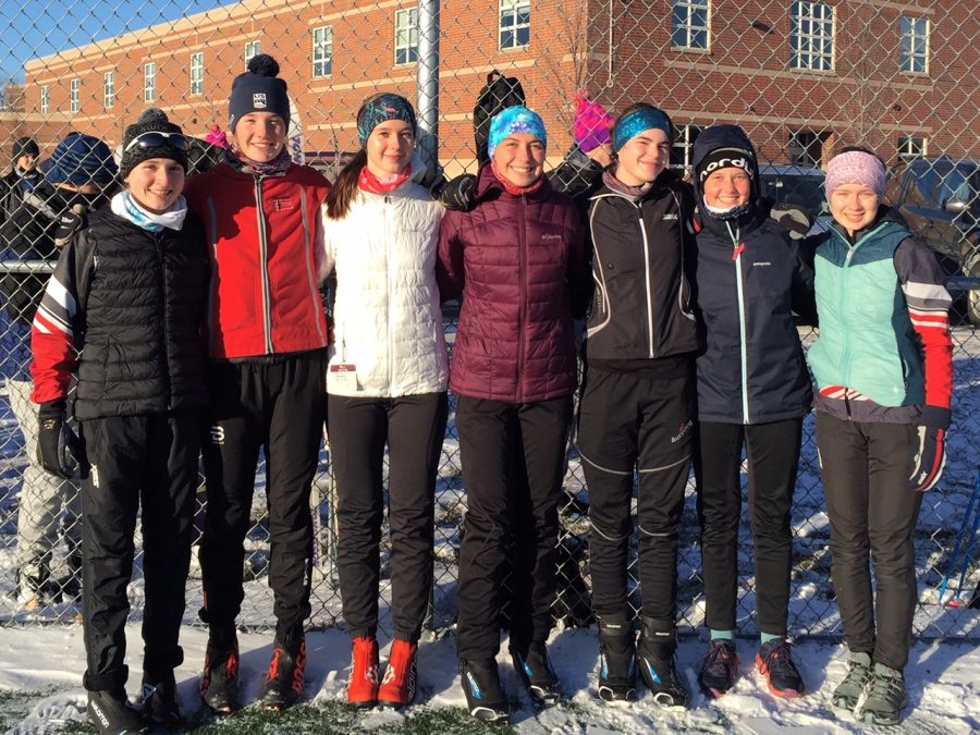The varsity girls nordic team prepares for their practice on Dec. 6. Races have been postponed due to the lack of snow prompting the girls to continue strength training and running workouts.