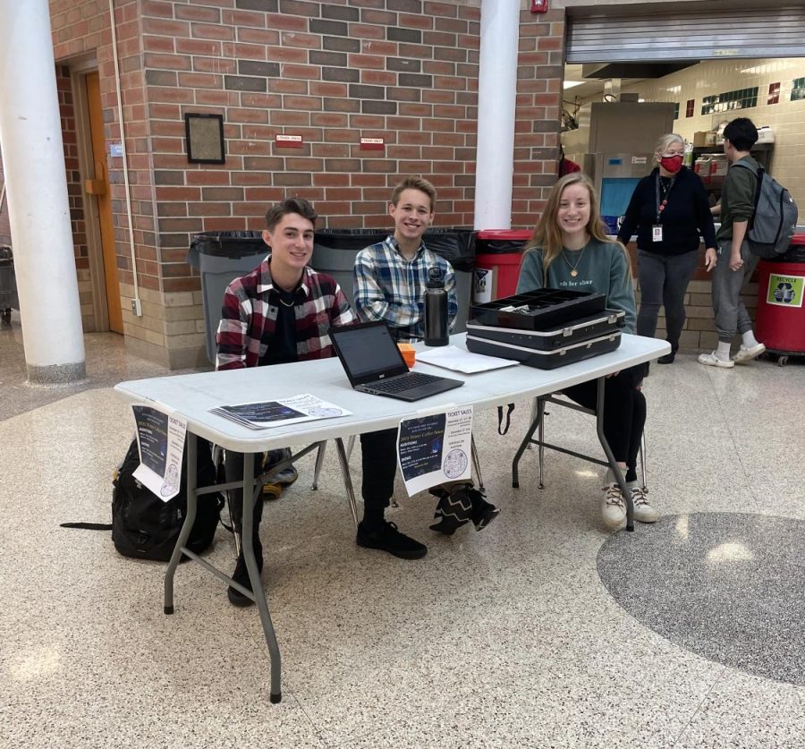 NHS officers selling Coffeehouse tickets in the cafeteria.