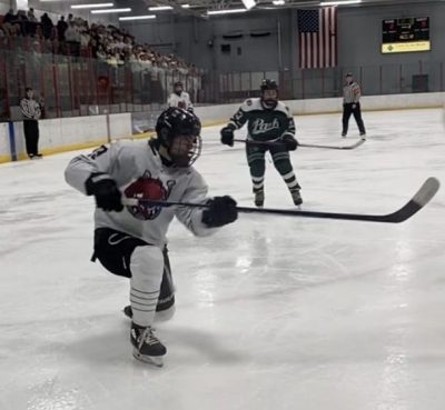 Junior Cam Briere scores during the Ponies home opener against Park. Briere moved back to Minnesota to play high school hockey for the Stillwater Ponies.