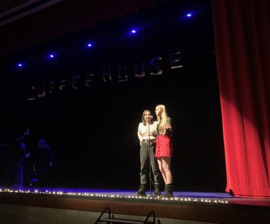 Senior Maggie Irwin and junior Katie Irwin introducing the next act of NHS Coffeehouse.