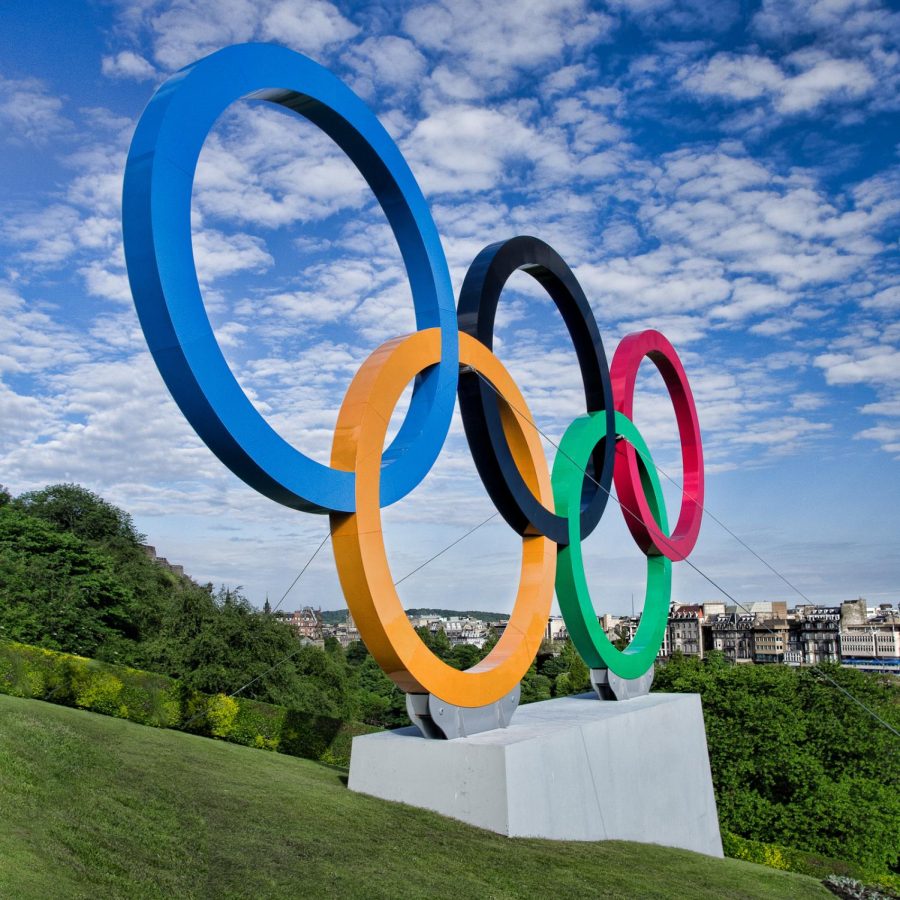A giant olympic rings statue on a hillside in Edinburgh
