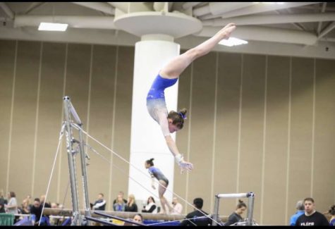 Junior Jordyn Lyden competing on bars at one of her  gymnastics meets.