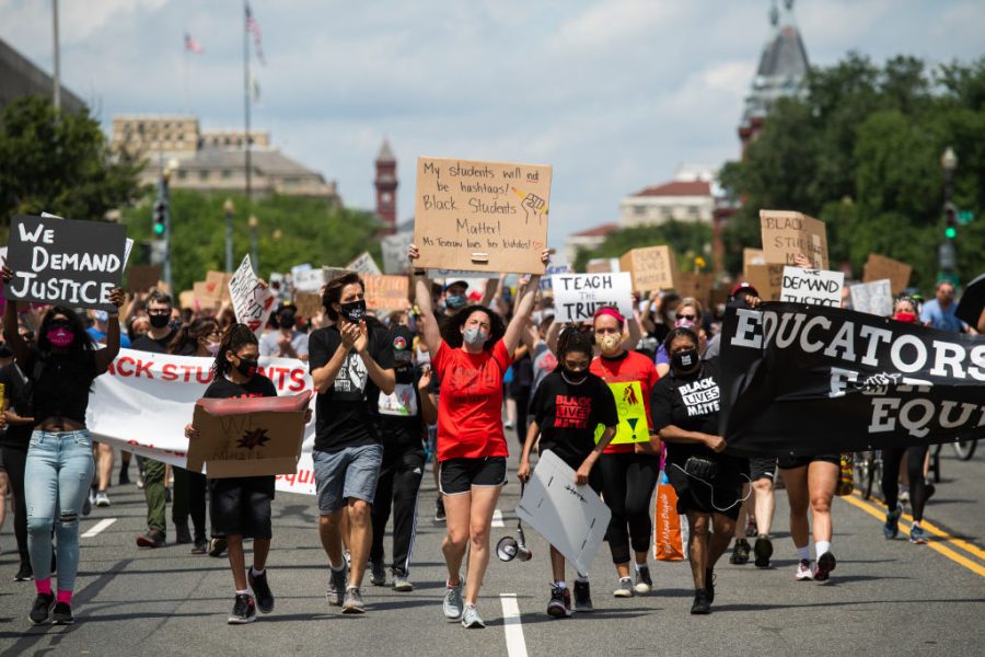 Students and educators march to the U.S. Department of Education in Washington D.C. on June 19, 2020