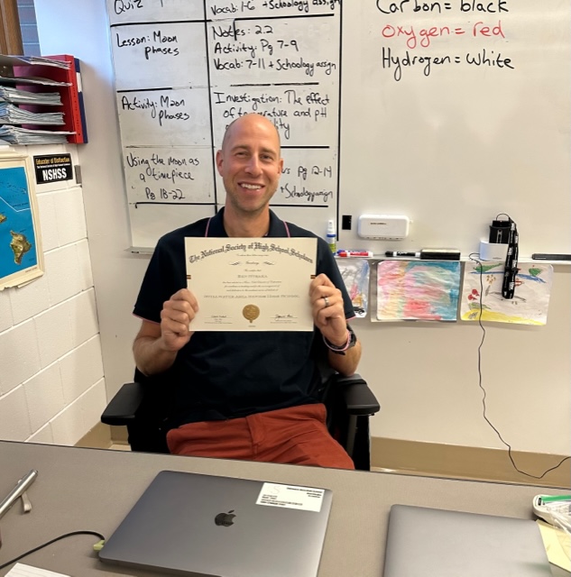 Benjamin Straka is showing his Clase Nobel Educator of Distinction award. He is a biology and astronomy teacher. This award is a great honor and he is very proud of it.