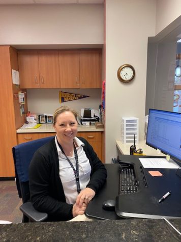 Alison Schroeder at work in the Main Office. She makes sure students get to class on time and that everyone is being safe in the parking lot. 